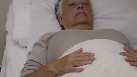 Acupuncturist inserts needles to a patient Video stock 99515985