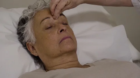 Acupuncturist inserts needles to a patient Video stock 99515992