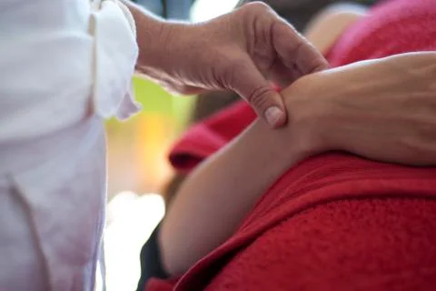 Acupuncturist taking chi pulse Stock Photos