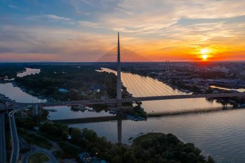 Ada Bridge at Sunset Over the Sava River in Belgrade, Serbia 库存照片