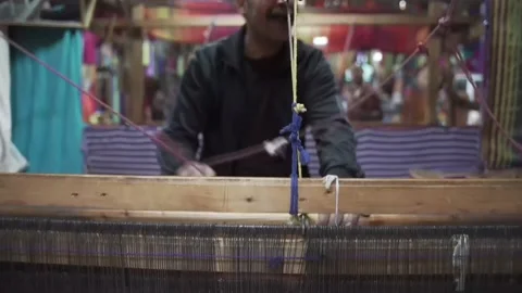 Adam's handiwork, the scarf loom in a stripe. Fez, Morocco, North Africa, 2022 Stock Footage 236303988