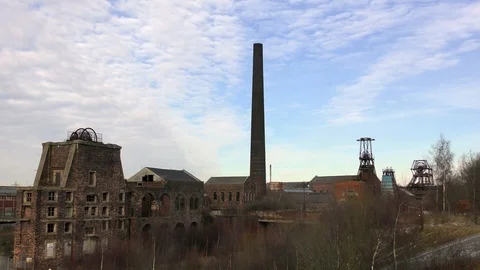 Adandoned derelict coal mine pit head moody desolate Stock Footage 85897088