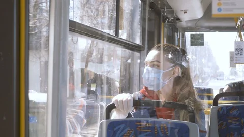 Adaptation to life in self-isolation COVID 19. A woman in a medical mask. Stock Footage 127754107