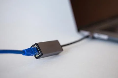 Adapter for connecting ethernet - type C in a modern laptop Stock Photos