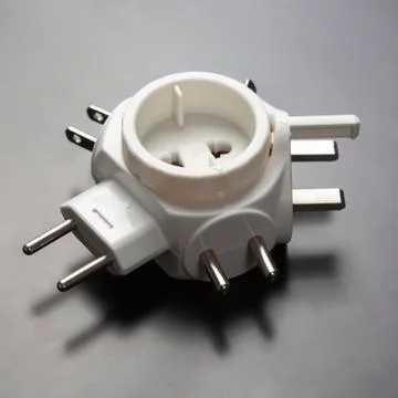 Adapter for different electrical plugs Stock Photos