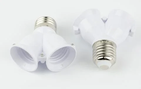 Adapter for two lamps on a white background. Stock Photos