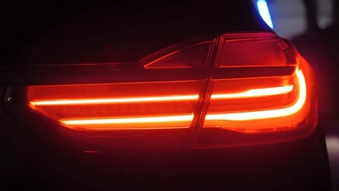 Adaptive LED optics for BMW 7 Series, close shot, color light and smoke, rear Stock Footage 125867969