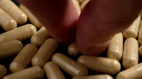 Adaptogen Ashwagandha root extract in herbal capsules Stock Footage 284089335