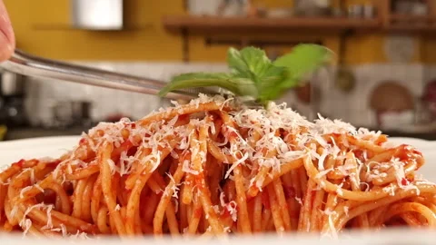 Add basil on top of spagetti dish Stock Footage 205328247