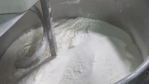 Add butter to the dough. slow motion Vídeo Stock 100736013