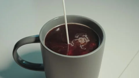 Add creamer to coffee Stock Footage 300209846