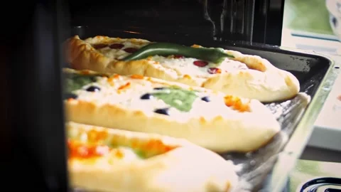 Add a hot pepper and an egg to the pide. Vegetarian pide pide with egg and pide Stock Footage 157298156