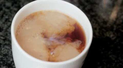 Add milk to tea Stock Footage 12733681