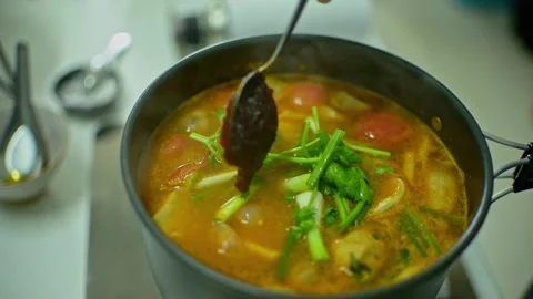 Add more chili paste to Tom Yum soup Stock Footage 161074528