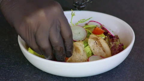 Add or put the tomatoes on the salad plate. Stock Footage 158781044