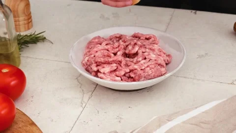 Add pepper into the minced meat for cooking bolognese sauce Stock Footage 196573367