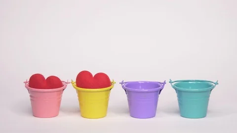 Add Red Hearth One By One into Colorful Bucket Stock Footage 103355110