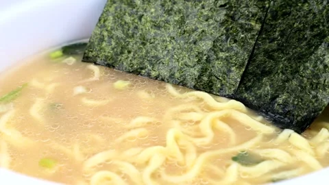 Add seaweed to instant ramen. Stock Footage 336331011