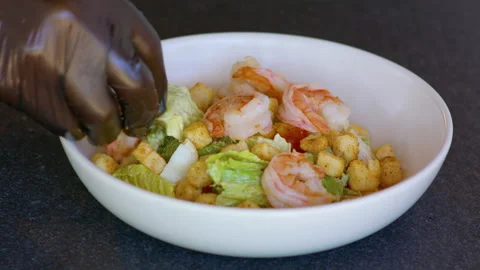 Add shrimp to salad. Stock Footage 158782374
