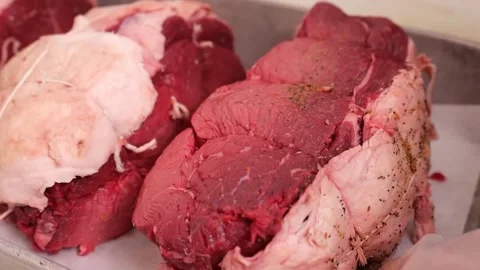 Add spices to the beef that has been tied tightly Stock Footage 171360771