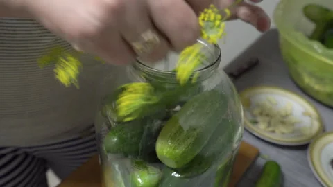Add spices to pickles in a jar Stock Footage 263755745