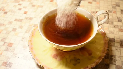 Add sugar to a cup of tea Stock Footage 122681480