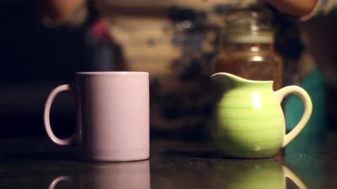 Add sugar to purple mug Stock Footage 159558602