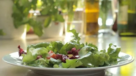 Add tomatoes to salad - slow motion Stock Footage 12713196