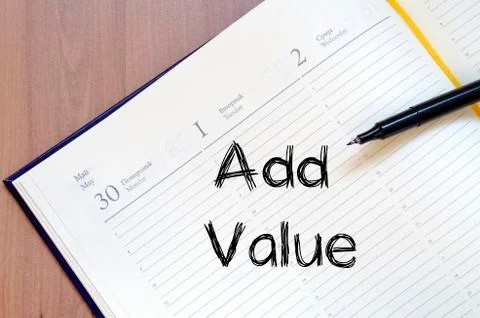 Add value write on notebook Stock Photos