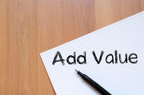 Add value write on notebook Stock Photos