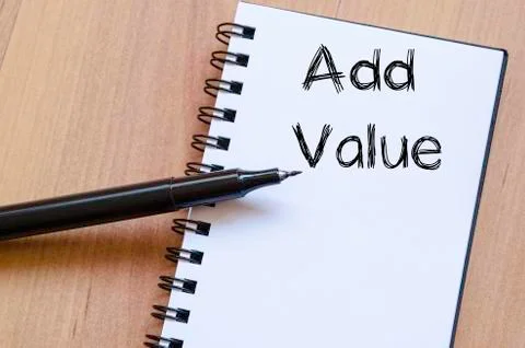 Add value write on notebook Stock Photos