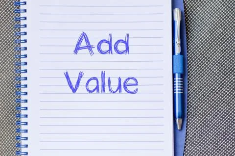 Add value write on notebook Stock Photos