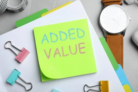 Added value concept. Flat lay composition with stationery on white table Stock Photos