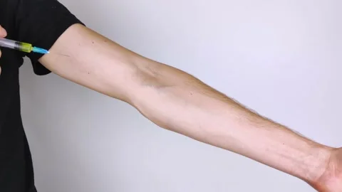 The addict makes himself an injection of prohibited preparation into the veins o Stock Footage 141847917