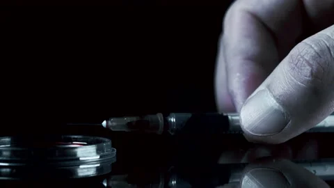 The addict puts the syringe on the table. Stock Footage 143215602