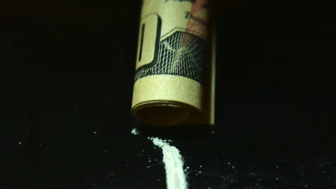Addict Sniffs line of cocaine. Stock Footage 109385638