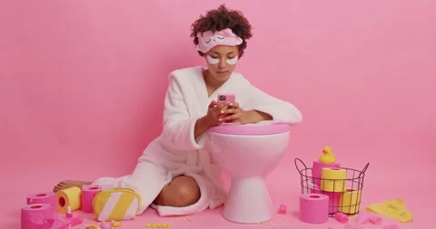 Addicted curly haired Afro American woman types text messages on smartphone Stock Footage 158319507