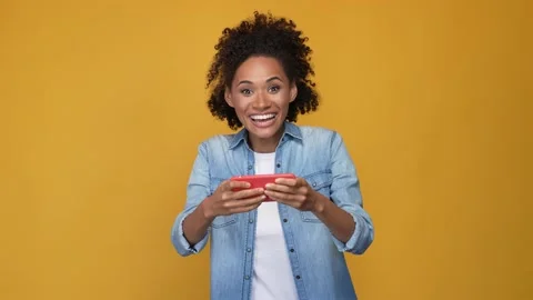 Addicted lady play device speed race fist up isolated vivid color background Stock Footage 167553687