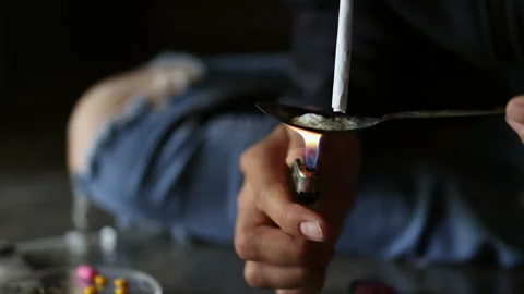 Addicted man using heroin, concept of crime and drug addiction. Anti drug con Stock Footage 336936014