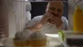 Addicted obese man eagerly eating burger at night, unhealthy nutrition, diet 4k or 4k+ Resolution