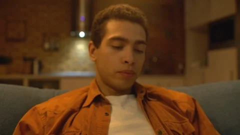 Addicted young man drinking alcohol from flusk alone, upset with life problems Stock Footage 124592401