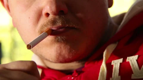 Addicted young man smoking cigarette at home  Vídeo Stock 36998047