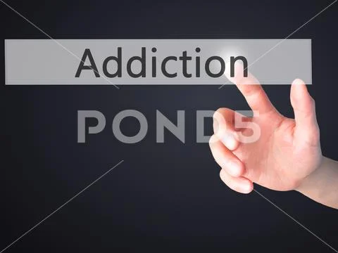 Addiction - Hand pressing a button on blurred background concept Stock Photos