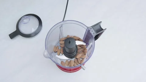Adding Almonds Into Blender Top View Food Preparation Видео 332810997