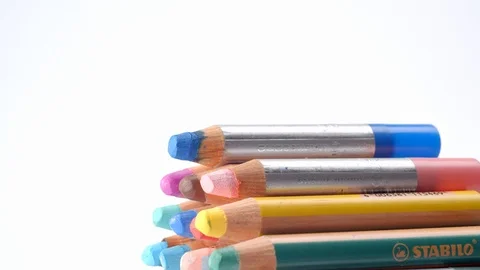 Adding to and adjusting a stack of colouring pencils Stock Footage 115695426