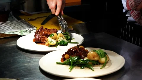 Adding asparagus onto a meal Stock Footage 107164800