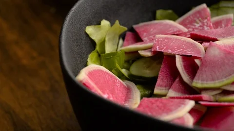 Adding Avocado To Spring Salad Stock Footage 116787251