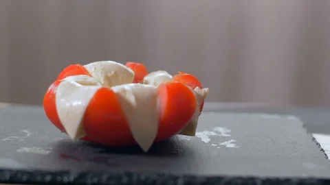Adding basil to the Caprese  Salad. Black background 動画素材 109268669