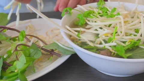 Adding Bean Sprouts To Vietnamese Pho Stock Footage 309284977