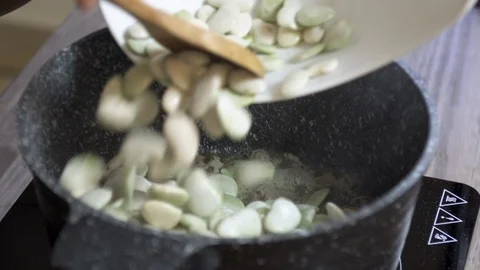 Adding beans over beef to make bean stew, Lebanese cuisine Stock Footage 122450559